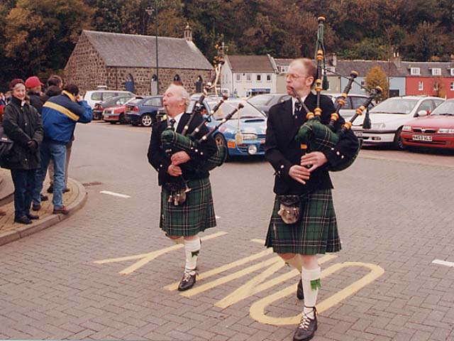 "You're right Angus, this is a good drop of malt" - Pipers leading the winner into the car park in Tobermory