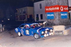 Sixth overall, First in Class C and "Best Scottish Crew" award - Willie Bonniwell and Ali Campbell in their Ford Escort Mk2 1998 going round the Clock Tower in Tobermory High Street on Friday Night's Millennium Stage