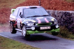The battered Escort takes to the air -